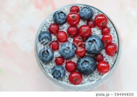 Chia seed pudding with blueberries and red currant berries in a glass Chia seed pudding with blueberries and red currant berries in a glass 59494850