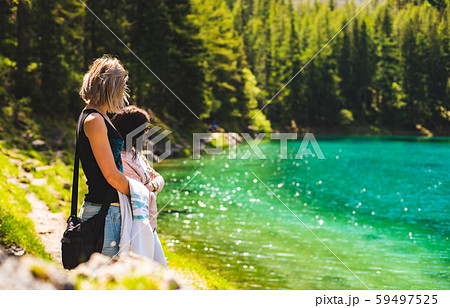 Two girls at green lake shore in styria, Austria. Two girls at green lake shore in styria, Austria. 59497525