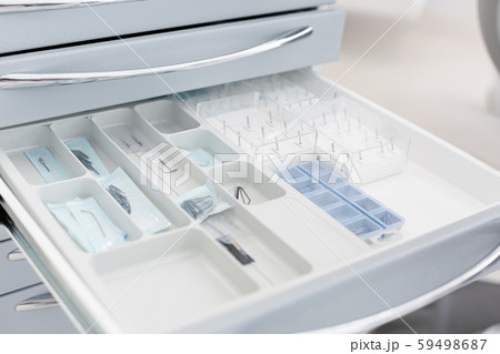 Close up of drill needles in open drawer 59498687