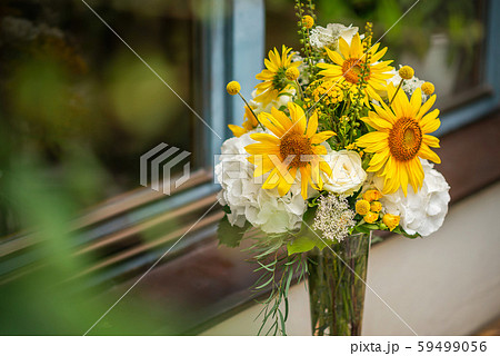 Beautiful floral arrangement or decoration for wedding or event. Sunflower Wedding Table centepiece/ summer colors. Beautiful floral arrangement or decoration for wedding or event. Sunflower Wedding Table centepiece/ summer colors. 59499056