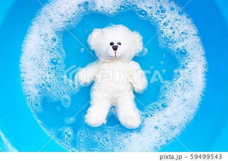 Soak toy bear in laundry detergent water Soak toy bear in laundry detergent water 59499543