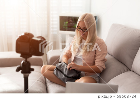 Young beauty blogger with laptop at home 59503724