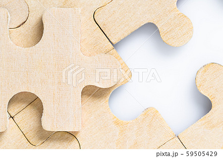 Missing jigsaw puzzle pieces on white 59505429
