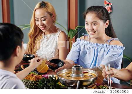 Preteen girl giving last skewer to brother Preteen girl giving last skewer to brother 59506506