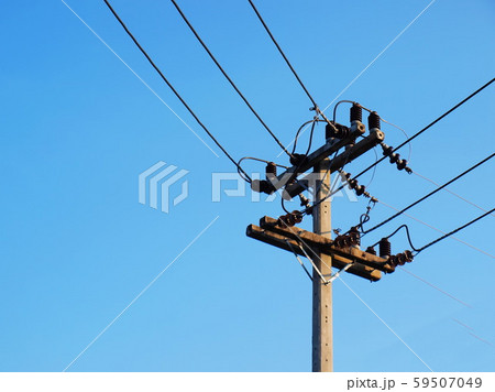 High voltage transmission line on the pole And changing the orthogonal way of laying high voltage electricity lines into communities or cities on a blue background With copy space. 59507049