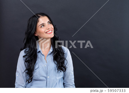 Young woman in a thoughtful pose 59507333