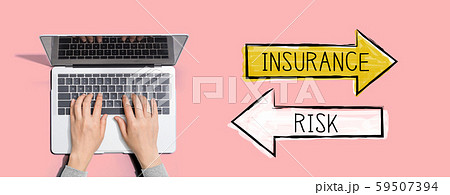 Insurance or risk with person using laptop computer 59507394