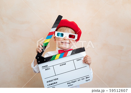 Funny kid holding clapper board Funny kid holding clapper board 59512607