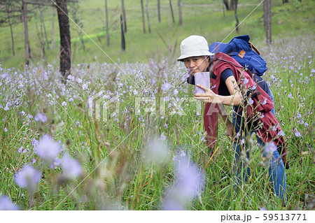 An Asian woman backpacking and selfie. An Asian woman backpacking and selfie. 59513771