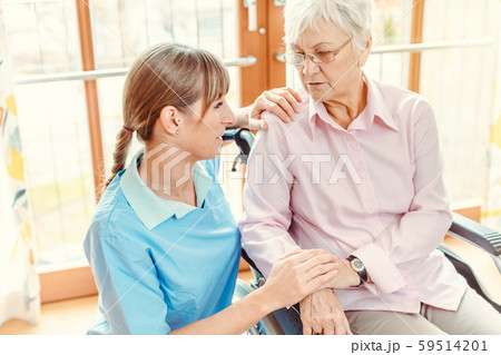 Caregiver and senior woman in nursing home 59514201