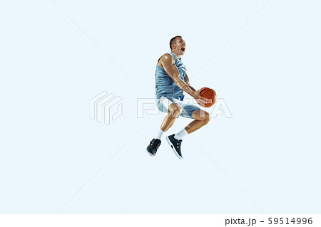 Young caucasian basketball player against white studio background 59514996