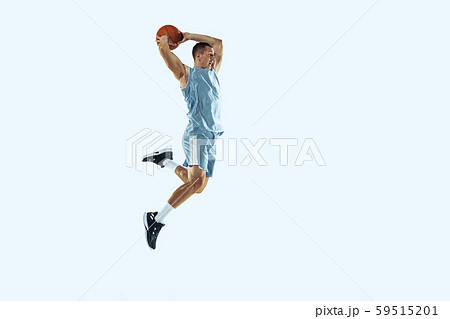 Young caucasian basketball player against white studio background 59515201