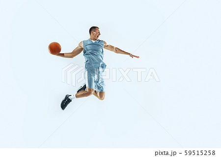 Young caucasian basketball player against white studio background 59515258