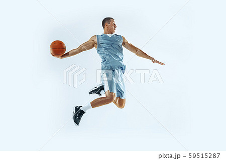 Young caucasian basketball player against white studio background Young caucasian basketball player against white studio background 59515287