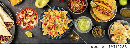 Mexican food overhead panoramic shot, many dishes of the cuisine of Mexico, flatlay on a dark Mexican food overhead panoramic shot, many dishes of the cuisine of Mexico, flatlay on a dark 59515288