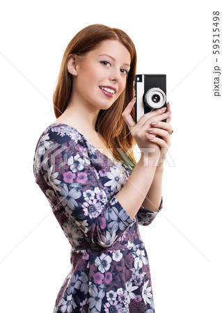 Young girl holding old film camera 59515498