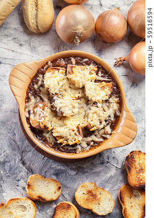 Delicious onion soup with croutons and cheese Delicious onion soup with croutons and cheese 59516594