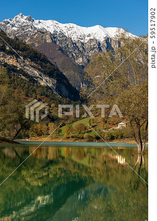 Lago di Tenno Trentino Italy - Beautiful lake with reflections in Italian Alps Lago di Tenno Trentino Italy - Beautiful lake with reflections in Italian Alps 59517902