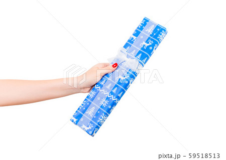 Woman hands give wrapped Christmas or other 59518513