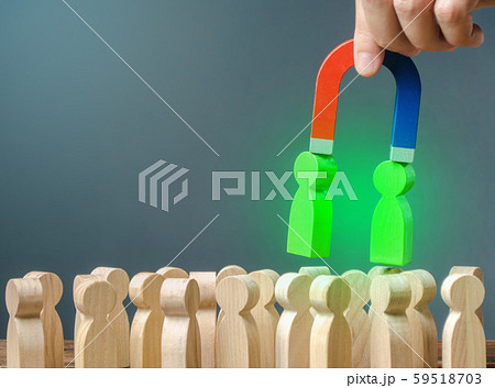 Businessman with a magnet pulls green figures of people out of the crowd. Recruiting new workers. Formation of a new team. Search for right people and talented workers with great career potential. Businessman with a magnet pulls green figures of people out of the crowd. Recruiting new workers. Formation of a new team. Search for right people and talented workers with great career potential. 59518703