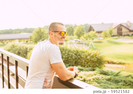Man standing outdoor and looking on rural landscape 59521582
