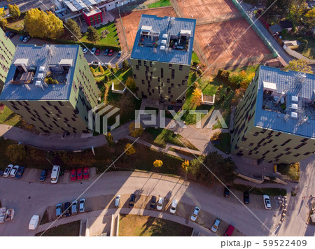 Aerial shot of modern buildings near the Old-fashioned Gasometer buidlings in Vienna from up above Aerial shot of modern buildings near the Old-fashioned Gasometer buidlings in Vienna from up above 59522409