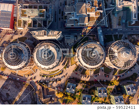 Beautiful drone shot of Old Gasometer buidlings in Vienna from up above. Used like gasholders, it is Beautiful drone shot of Old Gasometer buidlings in Vienna from up above. Used like gasholders, it is 59522411