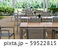 wooden and metal tables and chairs with garden. 59522815