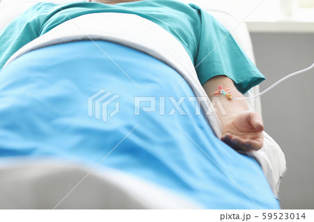 Man with IV in hospital 59523014