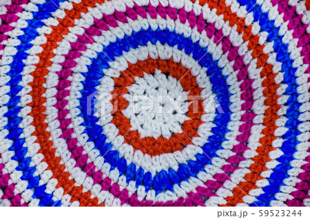 The texture of a knitted rug closeup. 59523244