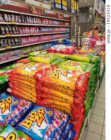 Selected focused powder detergent in plastic packaging displayed stacked together inside the huge supermarkets.  59523419