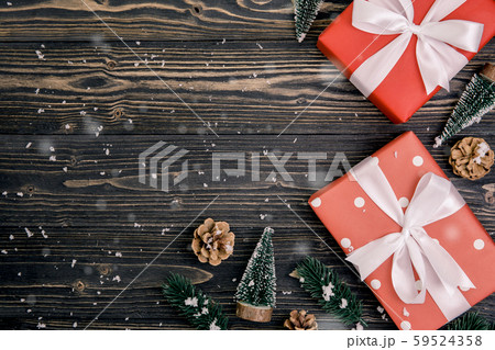 Christmas holiday composition with red gift box decoration on wooden background 59524358