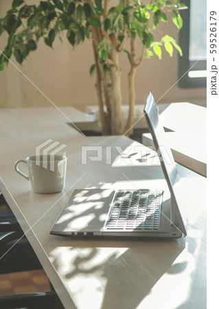 Modern workplace with laptop in the shadows. Modern workplace with laptop in the shadows. 59526179