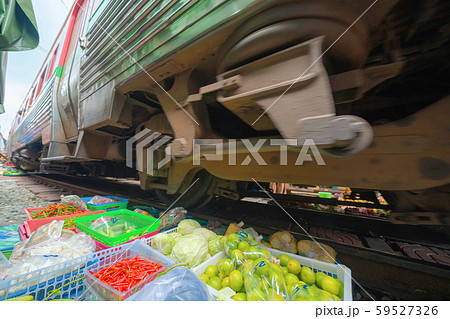 Rom Hoop market. Thai Railway with a local train Rom Hoop market. Thai Railway with a local train 59527326