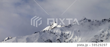 Sunlight mountain peak and cloudy sky in evening Sunlight mountain peak and cloudy sky in evening 59529297