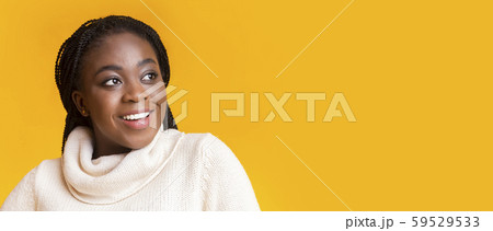 Interested young winter woman looking at copy space Interested young winter woman looking at copy space 59529533