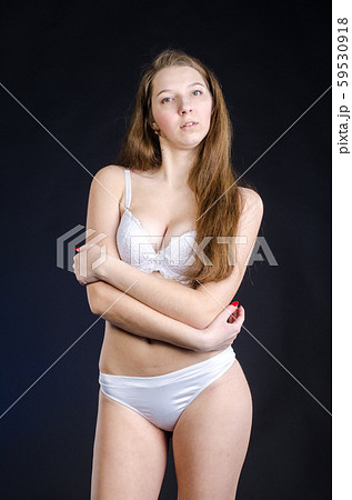 Sexy girl in lingerie on black background studio 59530918
