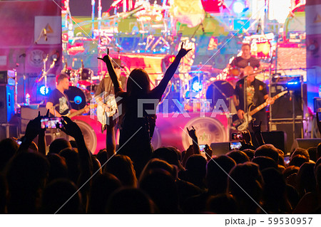 Fans at live rock music concert cheering 59530957
