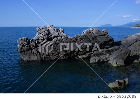 Amazing sunset seascape with rock and sea pebbles, vertical travel background, popular tourist Amazing sunset seascape with rock and sea pebbles, vertical travel background, popular tourist 59532088