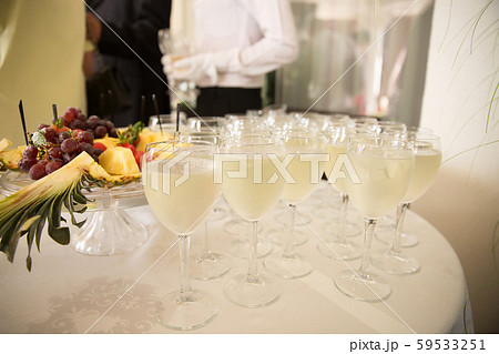 Glasses of champagne on the table. Celebration of wedding Glasses of champagne on the table. Celebration of wedding 59533251
