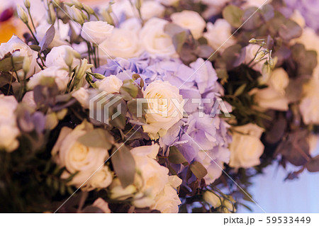 Wedding bouquet in restaurant on the table. Blue and white flowers. Rose and hydrangea Wedding bouquet in restaurant on the table. Blue and white flowers. Rose and hydrangea 59533449