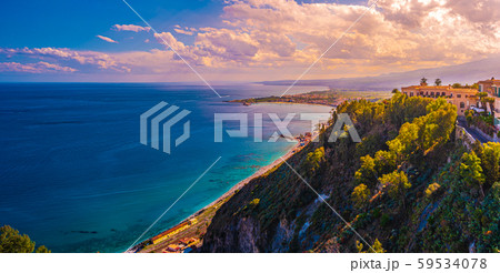 A panoramic view of Taormina, Giardini Naxos and 59534078