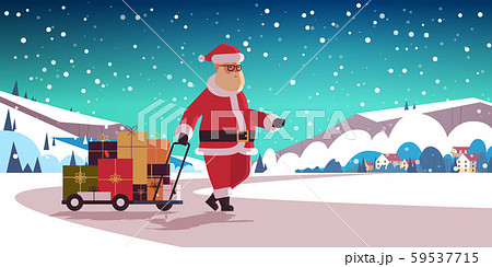 santa claus pulling trolley cart with gift present boxes merry christmas happy new year winter santa claus pulling trolley cart with gift present boxes merry christmas happy new year winter 59537715