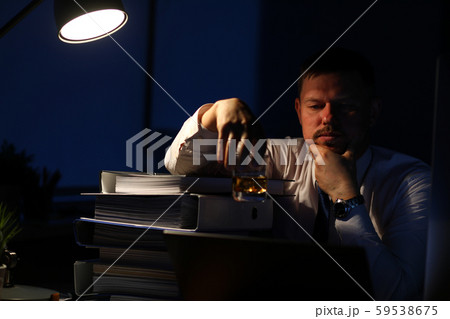 Exhausted concerned man relaxing in office Exhausted concerned man relaxing in office 59538675
