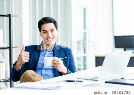 Happy of asian young businessman see a successful 59538780