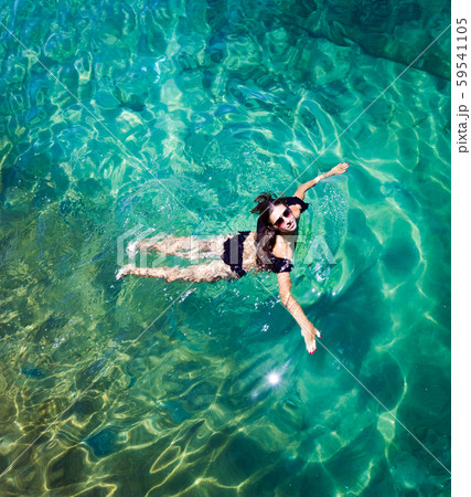 Aerial view of a woman in the sea 59541105