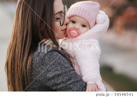 Portrait of mother and her little baby girl. Beautiful mom and cute baby. Mother hud her daughter 59546541