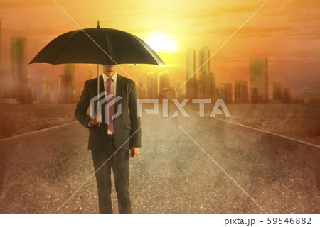 Asian businessman with an umbrella during a heatwave on the city Asian businessman with an umbrella during a heatwave on the city 59546882