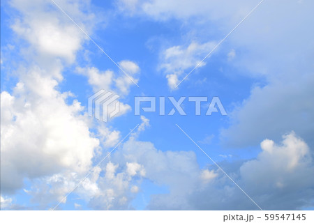 White clouds in the bright blue sky 59547145