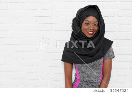 Pretty islamic woman in hijab and sport uniform posing Pretty islamic woman in hijab and sport uniform posing 59547324